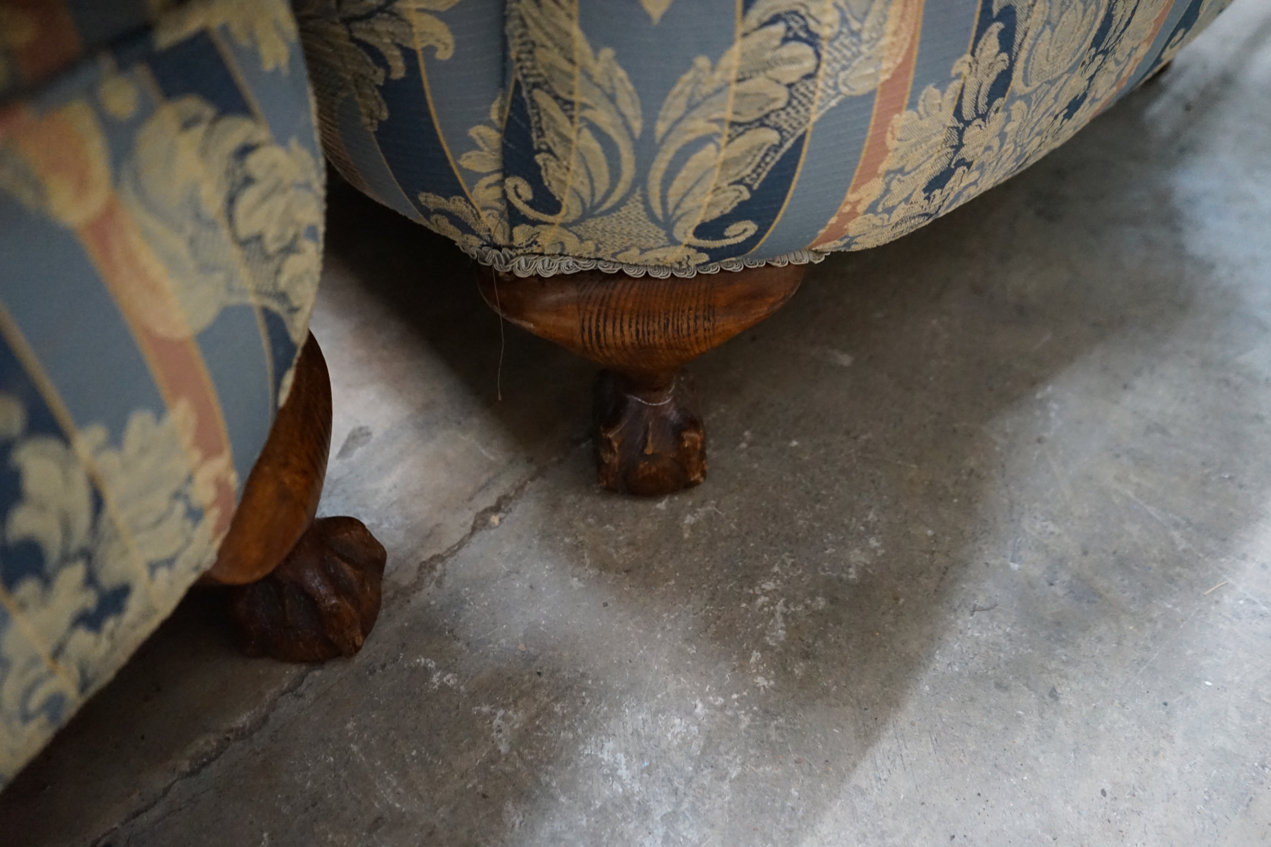 A pair of 1920's upholstered wing armchairs, width 74cm depth 70cm height 106cm